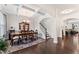 Elegant dining room features a coffered ceiling, hardwood floors, and stylish furnishings at 4907 Sleepy Falls Run, Knightdale, NC 27545