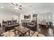 Expansive living area with leather recliners, an open concept kitchen and a dining area at 4907 Sleepy Falls Run, Knightdale, NC 27545