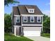 Charming two-story home featuring a two-car garage, dormer, and landscaped yard at 5208 Ranger Grove Way, Raleigh, NC 27604