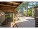 Backyard deck, featuring a cabana, a shed and a wooden deck, perfect for outdoor living at 5505 Pennfine Dr, Raleigh, NC 27610