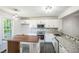 Bright kitchen with granite countertops, stainless appliances, and center island at 5505 Pennfine Dr, Raleigh, NC 27610