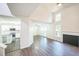 Airy living room featuring vaulted ceilings and new hardwood floors at 5505 Pennfine Dr, Raleigh, NC 27610