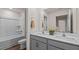 Stylish bathroom features double vanity, quartz countertops, and a shower-tub combination at 552 Stream Walk Xing, Wendell, NC 27591