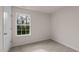 Cozy bedroom with soft carpet, freshly painted walls, and a bright window view at 552 Stream Walk Xing, Wendell, NC 27591