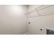 Functional laundry room with shelving, ample space for appliances, and laminate flooring at 552 Stream Walk Xing, Wendell, NC 27591