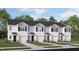 Charming townhome exterior with black shutters, white siding, and a single-car garage at 563 Stream Walk Xing, Wendell, NC 27591