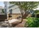 Charming backyard featuring a grill, tree, and lush landscaping at 5638 Wade Park Blvd, Raleigh, NC 27607