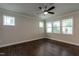 A well-lit bedroom features hardwood floors, neutral walls, and large windows at 5638 Wade Park Blvd, Raleigh, NC 27607