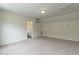 Spacious bonus room features neutral walls, carpeted floors, mini split, and adjacent bathroom at 5638 Wade Park Blvd, Raleigh, NC 27607