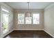 Bright dining area with backyard access, featuring natural light and hardwood floors at 5638 Wade Park Blvd, Raleigh, NC 27607