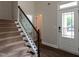 Entryway features a staircase, hardwood floors, and glass-paneled front door at 5638 Wade Park Blvd, Raleigh, NC 27607