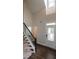 Entryway features a staircase, hardwood floors, and transom window front door at 5638 Wade Park Blvd, Raleigh, NC 27607