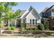 Charming home featuring stone accents, inviting entrance, landscaped yard, and a well-maintained lawn at 5638 Wade Park Blvd, Raleigh, NC 27607