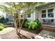 Charming front yard with lush greenery and covered entry at 5638 Wade Park Blvd, Raleigh, NC 27607