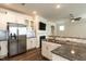 Granite counters and stainless steel appliances complement white cabinetry in this contemporary kitchen at 5638 Wade Park Blvd, Raleigh, NC 27607