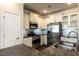 Bright kitchen boasts stainless appliances, granite countertops, and white cabinetry at 5638 Wade Park Blvd, Raleigh, NC 27607