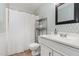 Full bathroom with geometric wallpaper, tiled floors, and a shower with a white curtain at 6225 Waterside Ln, Raleigh, NC 27613