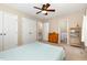 Bright bedroom with two closets and an en suite bathroom, featuring neutral tones at 6225 Waterside Ln, Raleigh, NC 27613