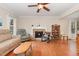Cozy living room with a fireplace and comfortable seating, creating a warm and inviting atmosphere at 6225 Waterside Ln, Raleigh, NC 27613