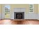 Living room with hardwood floors, fireplace, and access to the outdoors at 7404 Halifax Rd, Youngsville, NC 27596