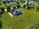 Expansive lawn surrounds this two-story home with a welcoming front porch in a neighborhood at 80 Shambley Meadows Dr, Pittsboro, NC 27312