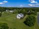 Spacious two-story home on a large lot with green lawns and trees in a lovely residential neighborhood at 80 Shambley Meadows Dr, Pittsboro, NC 27312