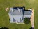 Drone's-eye view showing roof, driveway and tree cover at 80 Shambley Meadows Dr, Pittsboro, NC 27312