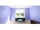 Lilac painted bedroom featuring desk and a large window overlooking the backyard at 80 Shambley Meadows Dr, Pittsboro, NC 27312