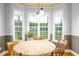 The bright breakfast nook features large windows that fill the space with natural light and lovely outdoor views at 80 Shambley Meadows Dr, Pittsboro, NC 27312