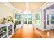 Sunny dining area with large windows offering natural light and views of the garden at 80 Shambley Meadows Dr, Pittsboro, NC 27312