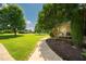 Beautiful landscaped front yard and walkway to the porch of this home at 80 Shambley Meadows Dr, Pittsboro, NC 27312