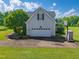 Spacious two-car garage with a basketball hoop and ample parking space on a grassy lot at 80 Shambley Meadows Dr, Pittsboro, NC 27312
