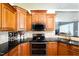 This kitchen has stainless steel appliances, granite countertops, custom cabinetry, and a modern double oven at 80 Shambley Meadows Dr, Pittsboro, NC 27312