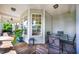Enjoy a pleasant outdoor meal on this covered porch with a dining table at 80 Shambley Meadows Dr, Pittsboro, NC 27312
