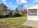Large backyard with a screen porch and wooden fence at 821 Stackhurst Way, Wake Forest, NC 27587