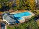 Aerial view of a community pool surrounded by mature trees at 821 Stackhurst Way, Wake Forest, NC 27587