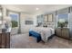 Spacious bedroom with natural light, neutral walls, carpeted floors, and stylish decor at 848 Ottawa Dr, Garner, NC 27529