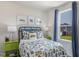 Bright bedroom with playful bedding, colorful accents, and a view of the outdoors at 848 Ottawa Dr, Garner, NC 27529