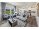 Inviting living room with hardwood floors, plush seating, and natural light at 848 Ottawa Dr, Garner, NC 27529
