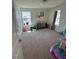 Bright, carpeted bedroom with toys, natural light, and ample space for children to play at 99 Still Hand Dr, Clayton, NC 27527
