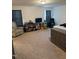 Cozy bedroom featuring carpet flooring, neutral walls, and plenty of natural light at 99 Still Hand Dr, Clayton, NC 27527