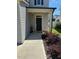 Exterior entrance showcasing the front door and small, landscaped garden in front at 99 Still Hand Dr, Clayton, NC 27527