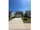 Charming two-story home featuring a two-car garage and a well-manicured front yard at 99 Still Hand Dr, Clayton, NC 27527