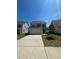 Charming two-story home featuring a two-car garage and a well-manicured front yard at 99 Still Hand Dr, Clayton, NC 27527