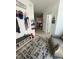 Foyer with coat rack, shoe storage, and stylish rug that invites one into the home at 99 Still Hand Dr, Clayton, NC 27527