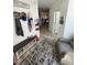 Foyer with coat rack, shoe storage, and stylish rug that invites one into the home at 99 Still Hand Dr, Clayton, NC 27527