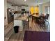 Open concept kitchen with large island, stainless appliances and adjacent dining area at 99 Still Hand Dr, Clayton, NC 27527