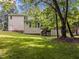 Expansive backyard with a private deck and stairs, ideal for outdoor gatherings and relaxation at 100 Silver Lining Ln, Cary, NC 27513