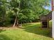 Green backyard showcasing the home's deck, offering an ideal setting for relaxation and outdoor living at 100 Silver Lining Ln, Cary, NC 27513