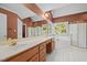 Well-lit bathroom with double vanity, soaking tub, walk-in shower, and ample counter space at 100 Silver Lining Ln, Cary, NC 27513